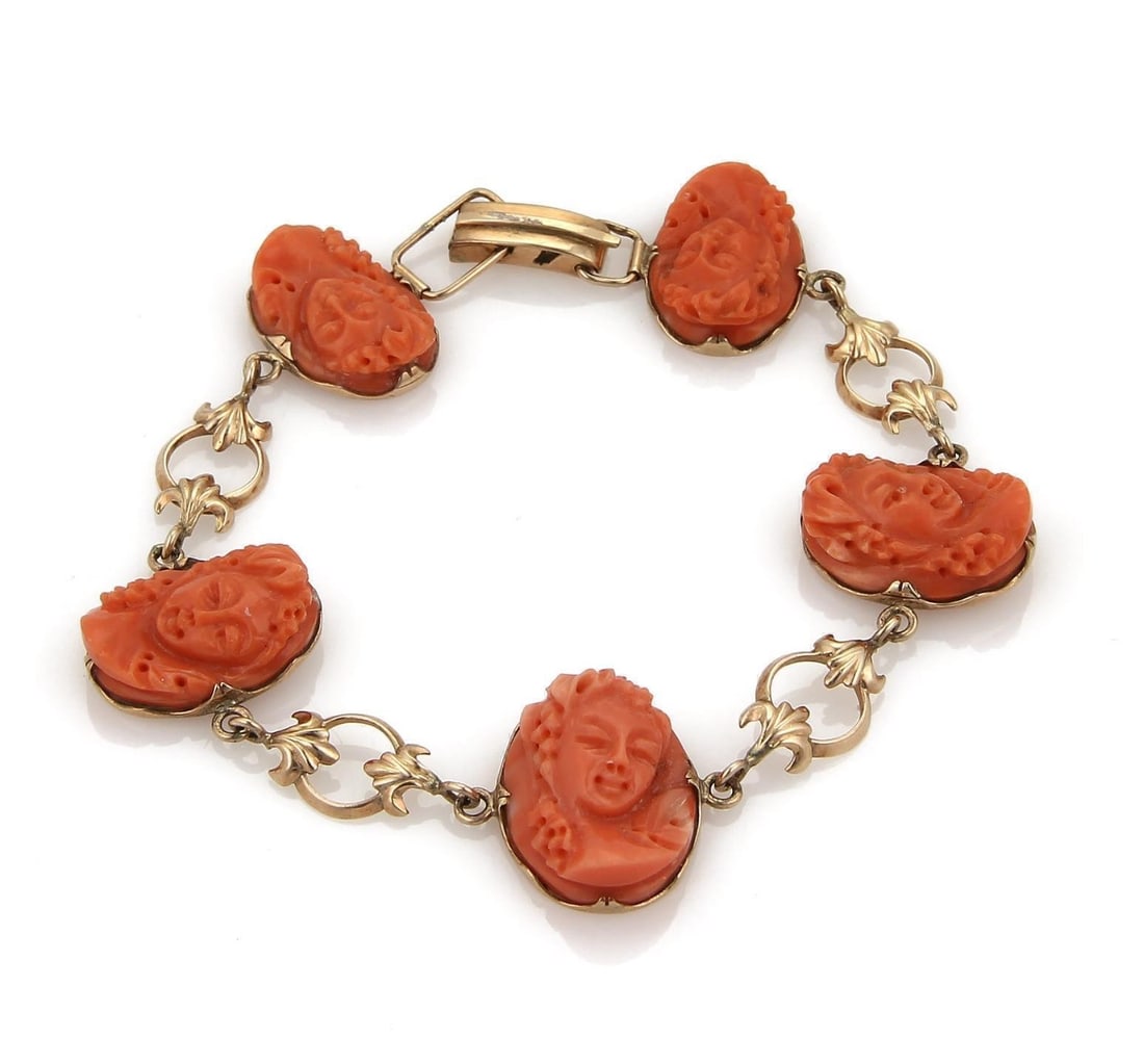 Antique 14k Rose Gold Bracelet with Carved Coral Cameo Woman Busts: Antique 14k Rose Gold Bracelet with Carved Coral Cameo Woman Busts This antique link bracelet is crafted in 14k rose gold and features five high-relief coral cameos, each intricately carved to depict
