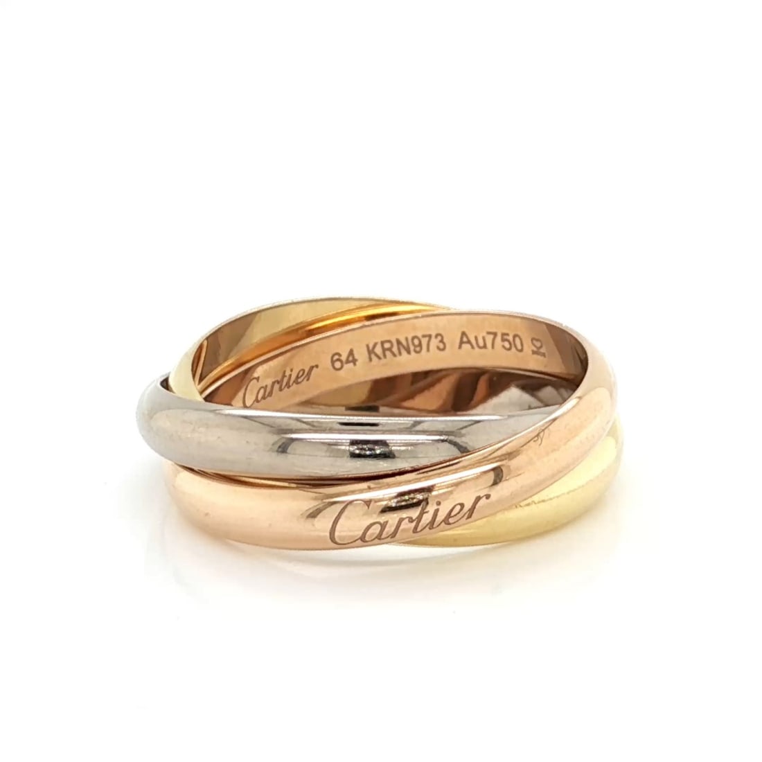 Trinity Classic 18k Tri Color Gold Ring by Cartier with Certificate Size 64: Trinity Classic 18k Tri Color Gold Ring by Cartier with Certificate Size 64 This authentic Cartier Trinity Classic band ring is crafted from solid 18k yellow, white, and rose gold, featuring the iconi
