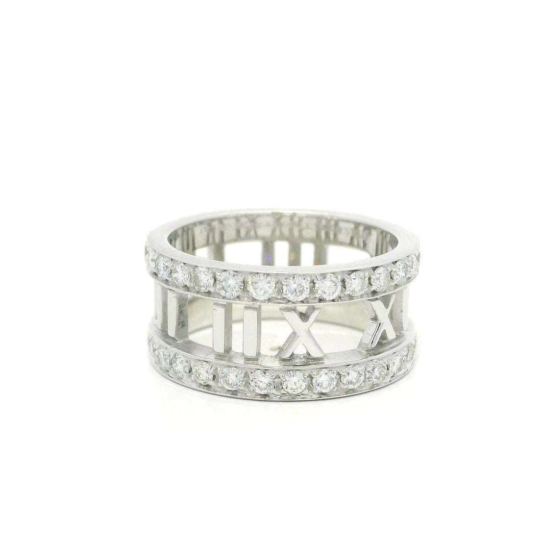 Tiffany & Co. Atlas 18k White Gold Diamond Roman Numeral Ring Size 5: Tiffany & Co. Atlas 18k White Gold Diamond Roman Numeral Ring Size 5 Presenting the Tiffany & Co. Atlas 18k Gold Diamond Pierced Roman Numeral Wide Band Ring, size 5. This exquisite band features 30 n