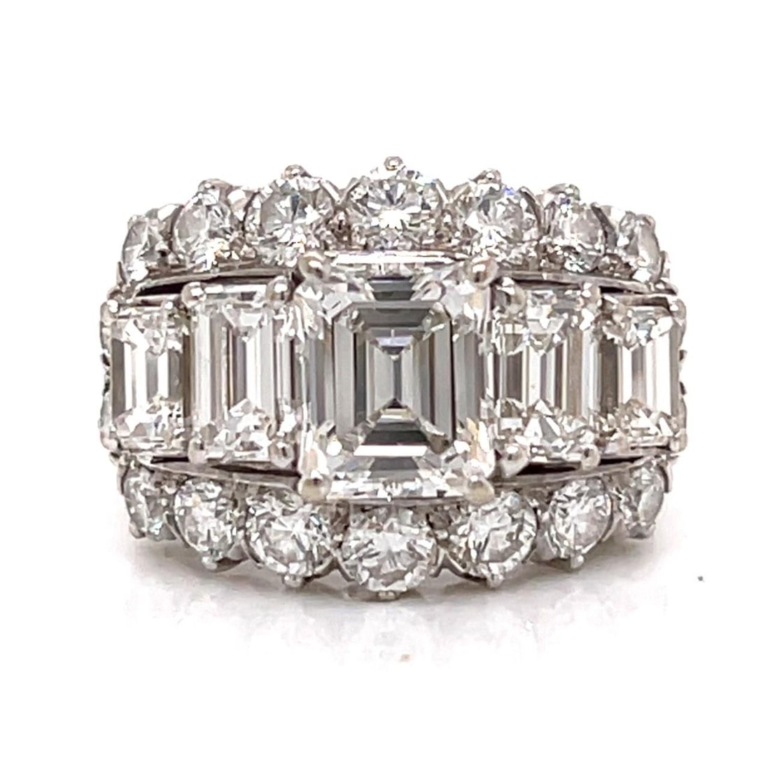 5.35 Carat Diamond Ring in 18K White Gold with Emerald Cuts: 5.35 Carat Diamond Ring in 18K White Gold with Emerald Cuts This elegant ring is crafted from 18K white gold and features a total diamond weight of approximately 5.35 carats. The centerpiece is an eme