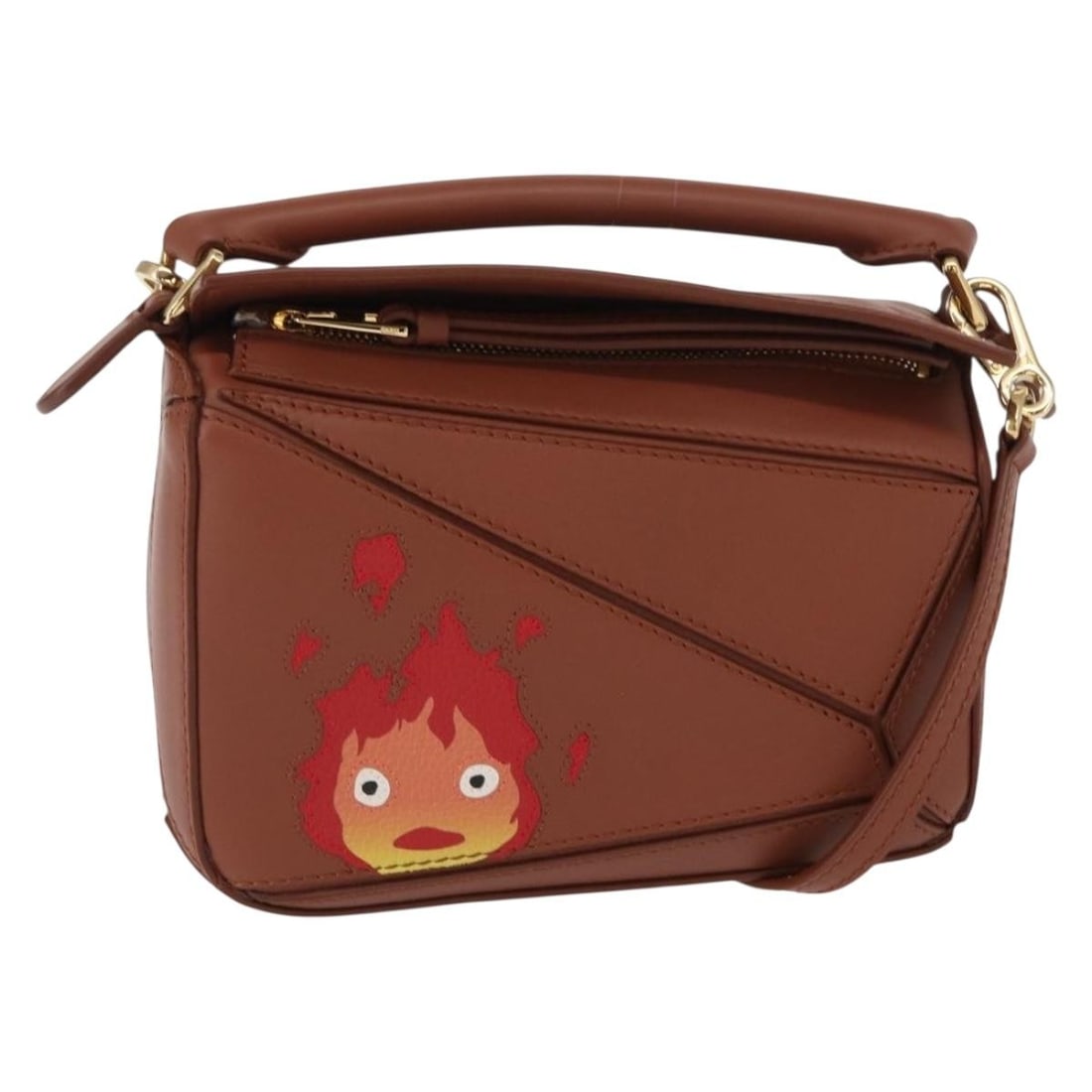 LOEWE Mini Puzzle Bag x Studio Ghibli Calcifer Brown Leather Auth BA9009SM: LOEWE Mini Puzzle Bag x Studio Ghibli Calcifer Brown Leather Auth BA9009SM Introducing the LOEWE Mini Puzzle Bag, a stunning collaboration with Studio Ghibli featuring the iconic Calcifer design. This