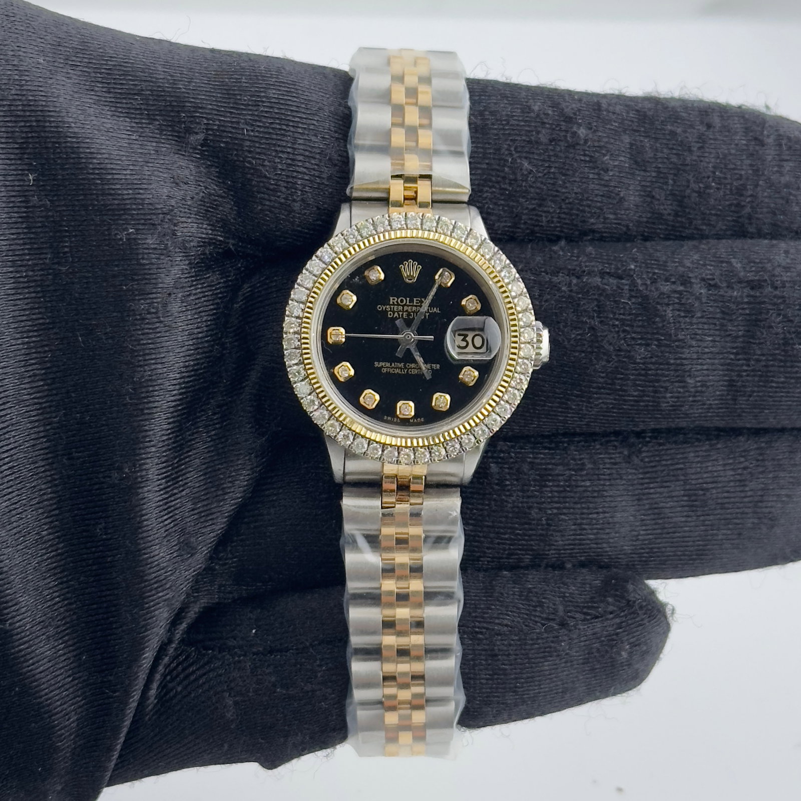 Ladies Datejust Ref 6517 Aftermarket Black Diamond Dial Jubilee Bracelet Watch: Ladies Datejust Ref 6517 Aftermarket Black Diamond Dial Jubilee Bracelet Watch This ladies' Rolex Datejust features an aftermarket black diamond dial and an aftermarket Jubilee bracelet with a hidden