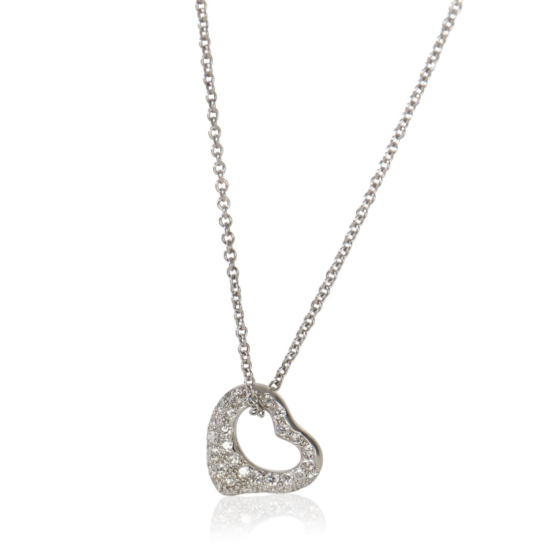 Elsa Peretti Open Heart Platinum Diamond Pendant by Tiffany & Co.: Elsa Peretti Open Heart Platinum Diamond Pendant by Tiffany & Co. This Tiffany & Co. Elsa Peretti Open Heart pendant features a round brilliant diamond set in platinum. The necklace measures 18 inches