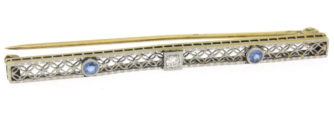 Antique 14K Gold Platinum Filigree Bar Pin with Diamond Synthetic Sapphires: Antique 14K Gold Platinum Filigree Bar Pin with Diamond Synthetic Sapphires This exquisite antique bar pin showcases a stunning combination of 14K yellow gold and platinum in an open filigree design,