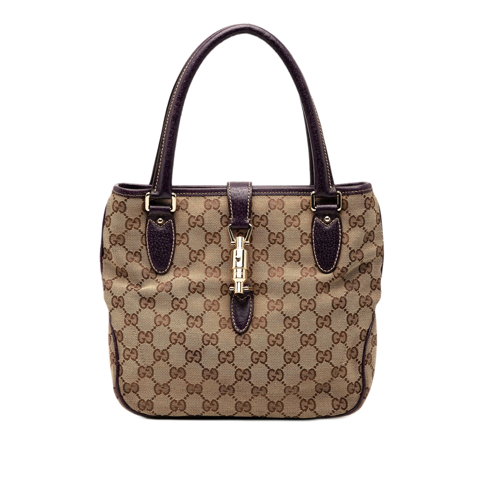 Brown GG Canvas Jackie Tote Bag with Leather Trim by Gucci: Brown GG Canvas Jackie Tote Bag with Leather Trim by Gucci This Gucci GG Canvas Jackie Tote features a canvas body with leather trim, rolled leather handles, an open top with piston lock closure, and