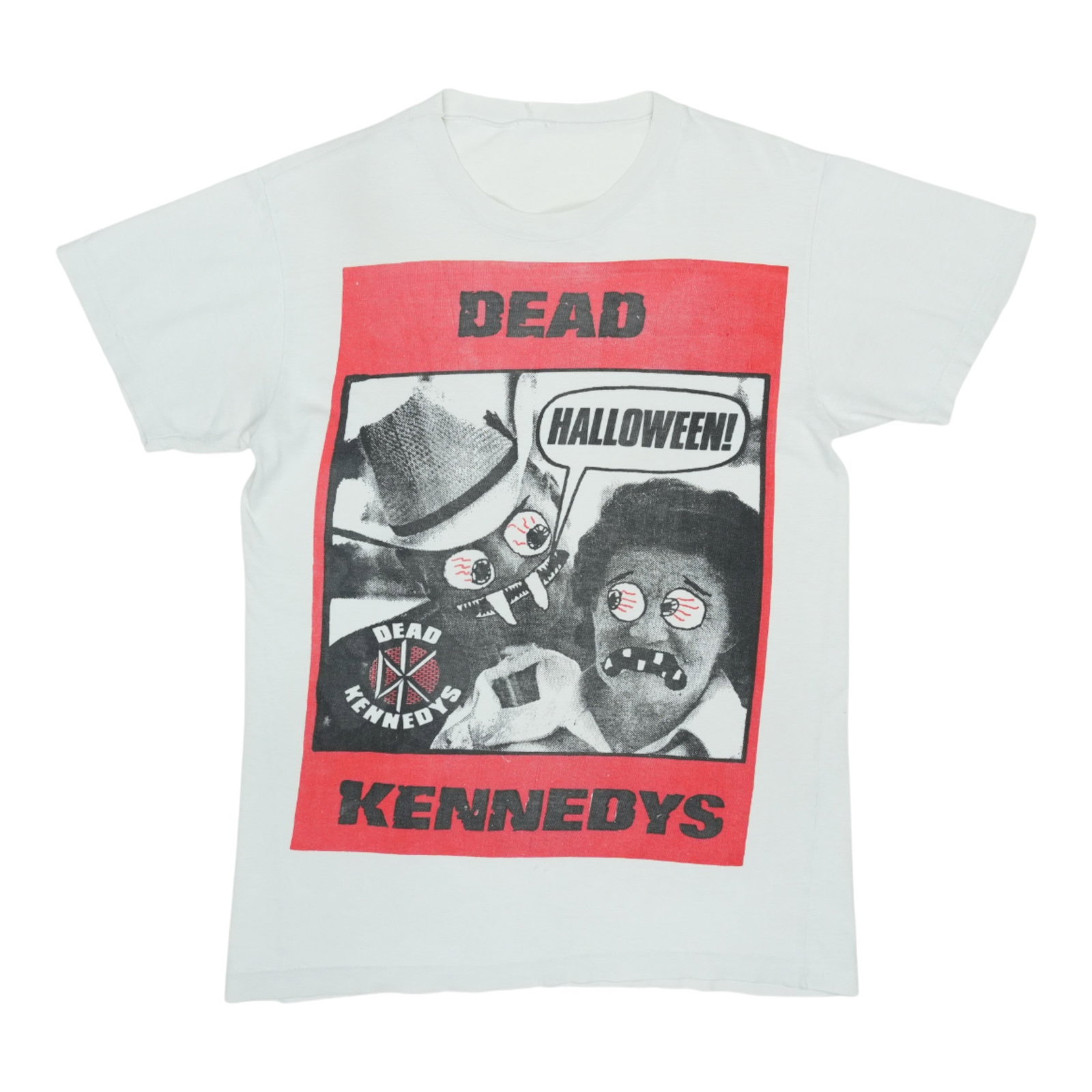 Vintage 198s Dead Kennedys White Cotton Halloween T-Shirt: Vintage 198s Dead Kennedys White Cotton Halloween T-Shirt This is an original vintage 198s Dead Kennedys Halloween shirt. It features a classic white design without any back graphics. The shirt is mad