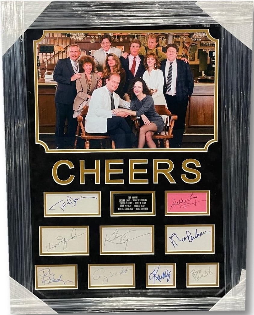 Cheers Autographed Cuts 26x34 Framed with Woody Harrelson Beckett Authenticated: Cheers Autographed Cuts 26x34 Framed with Woody Harrelson Beckett Authenticated This striking framed piece features autographed cuts from eight acclaimed cast members of the beloved television show 'C