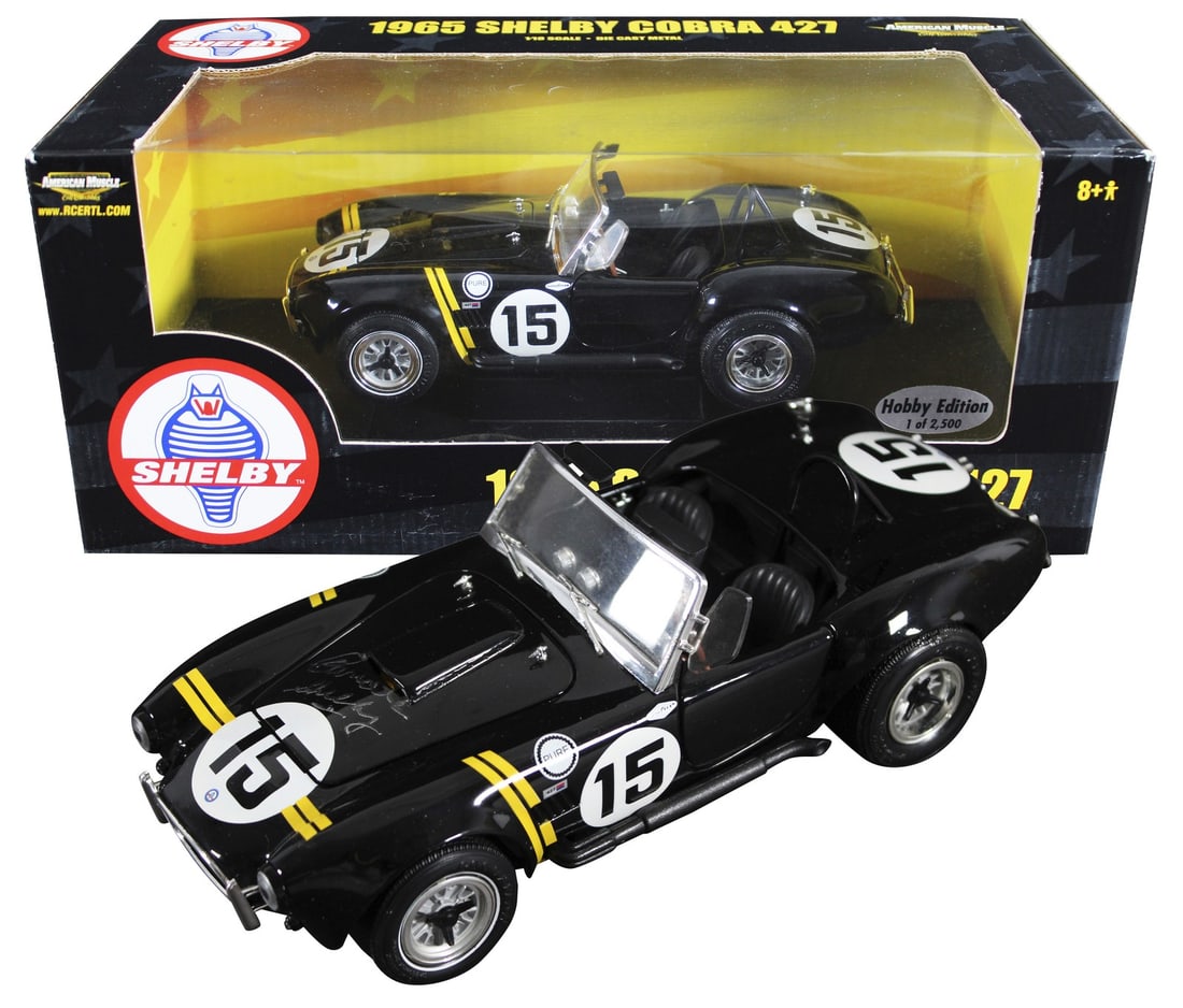Carroll Shelby Autographed 1965 Shelby Cobra 427 Die Cast 1:18 BAS Authenticated: Carroll Shelby Autographed 1965 Shelby Cobra 427 Die Cast 1:18 BAS Authenticated This 1965 Shelby Cobra 427 1:18 Scale Die Cast Car has been personally signed by automotive legend Carroll Shelby. Each
