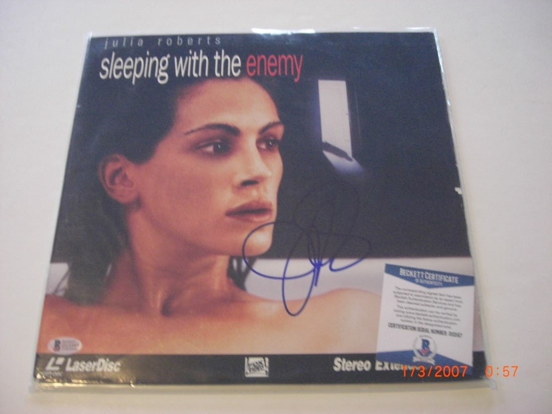 Signed Sleeping with the Enemy Laserdisc Album with Beckett COA: Signed Sleeping with the Enemy Laserdisc Album with Beckett COA This is an original laserdisc album for the film "Sleeping with the Enemy," signed by Julia Roberts. The album is from the United States