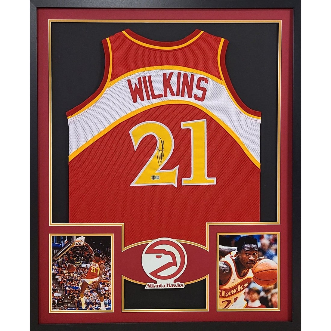 Dominique Wilkins Signed Framed Jersey Beckett Authenticated 42x34: Dominique Wilkins Signed Framed Jersey Beckett Authenticated 42x34 This autographed Dominique Wilkins framed jersey is a stunning piece for any sports memorabilia collector. The jersey features a deta