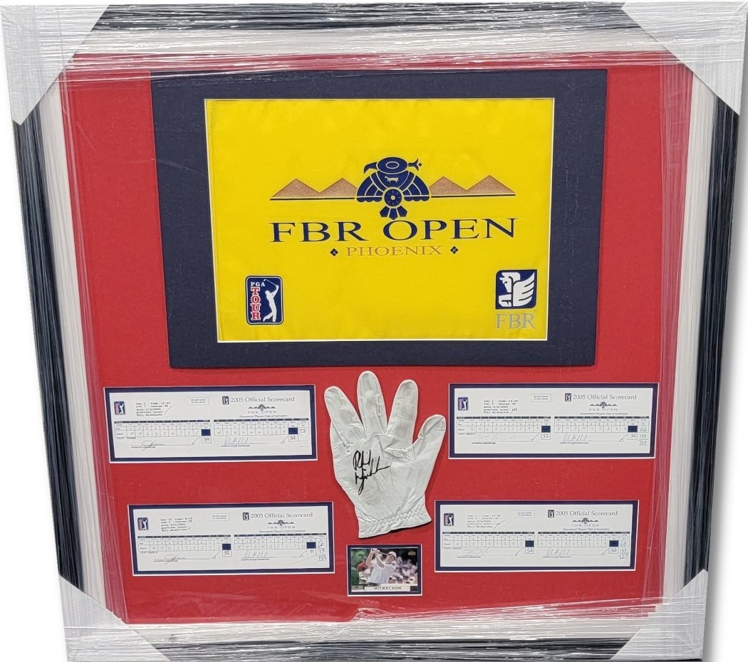 Autographed Phil Mickelson Glove and Scorecards Custom Framed with COA: Autographed Phil Mickelson Glove and Scorecards Custom Framed with COA This custom-framed display features a used glove autographed by Phil Mickelson, accompanied by scorecards. The glove is presented