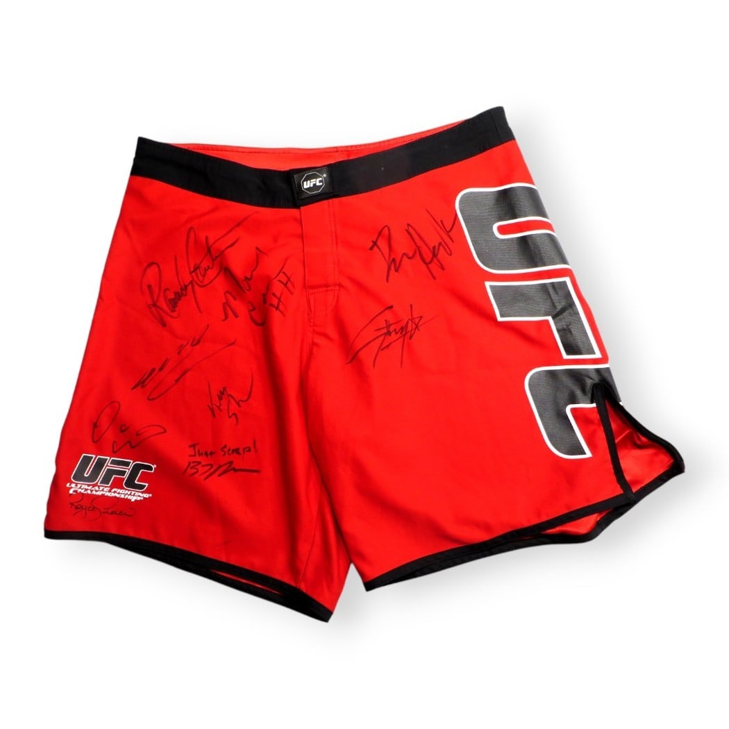 UFC Legends Multi Signed Trunks 9 Autographs Beckett Authenticated: UFC Legends Multi Signed Trunks 9 Autographs Beckett Authenticated This is a unique pair of trunks signed by some of the greatest names in Mixed Martial Arts (MMA). The trunks feature autographs from