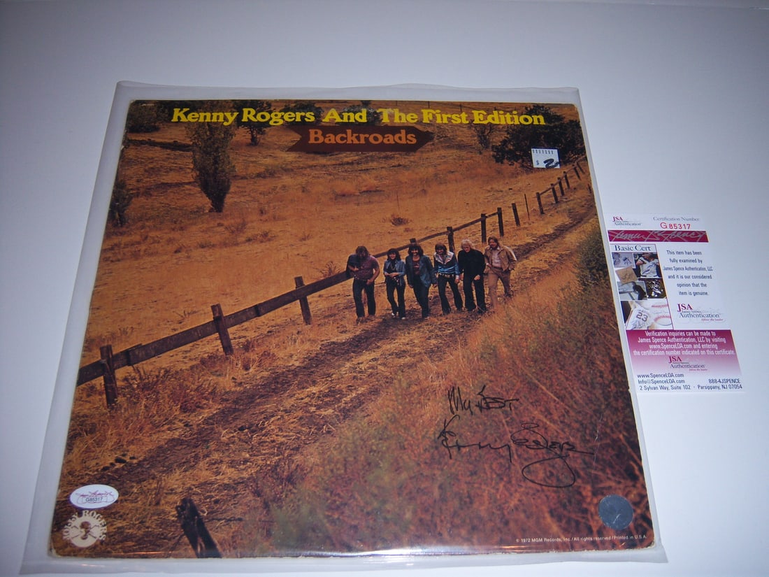 Kenny Rogers Autographed Backroads LP Album With JSA Certificate: Kenny Rogers Autographed Backroads LP Album With JSA Certificate This is an original LP record album titled "Backroads" signed by Kenny Rogers. The album comes with JSA/COA authentication and is from