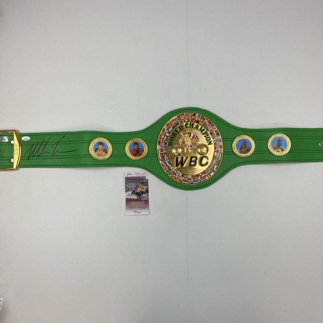 Mike Tyson Signed WBC Green Boxing Replica Belt with JSA COA: Mike Tyson Signed WBC Green Boxing Replica Belt with JSA COA This is an authentic autographed replica championship belt commemorating the legendary Mike Tyson, featuring the WBC green design. The belt