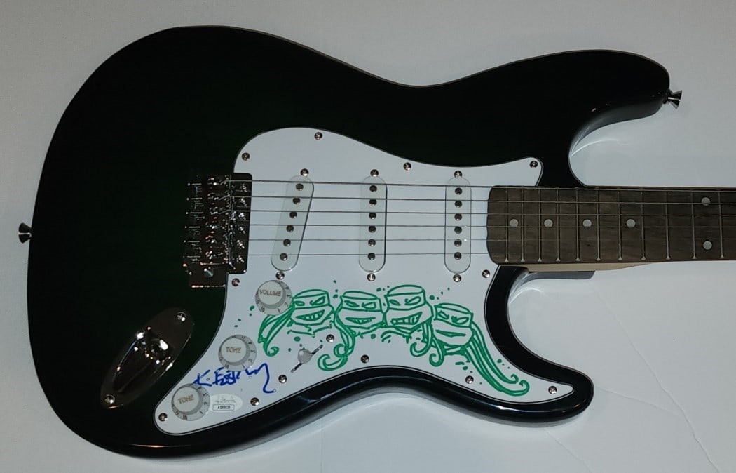 Electric Guitar Signed by Kevin Eastman with TMNT Sketch JSA Authenticated: Electric Guitar Signed by Kevin Eastman with TMNT Sketch JSA Authenticated This electric guitar features the autograph of Kevin Eastman and includes a Teenage Mutant Ninja Turtles (TMNT) sketch. The s