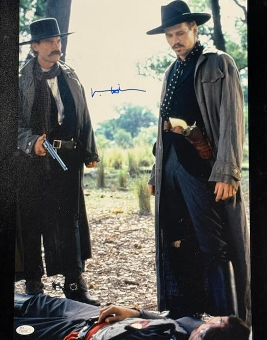 Val Kilmer Signed 16x20 Tombstone Photo JSA Authenticated: Val Kilmer Signed 16x20 Tombstone Photo JSA Authenticated This is an original 16x20 photograph featuring Val Kilmer, famously known for his role in the movie Tombstone, and it is signed by him. The au
