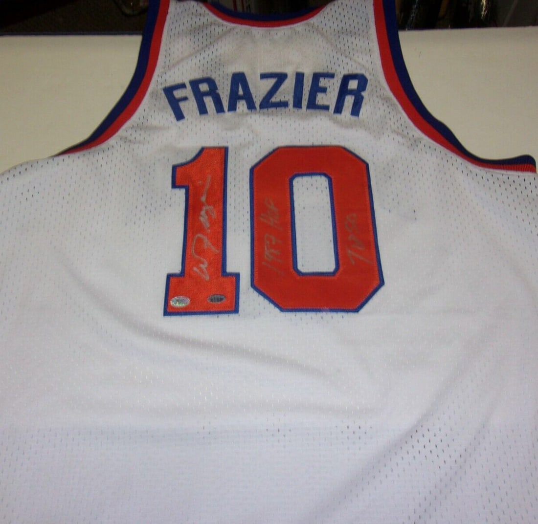 Signed Walt Frazier Basketball Jersey With HOF 1987 And Top 50 Inscription COA: Signed Walt Frazier Basketball Jersey With HOF 1987 And Top 50 Inscription COA This is a pre-owned New York Knicks jersey signed by Walt Frazier, a Hall of Famer inducted in 1987 and recognized as one