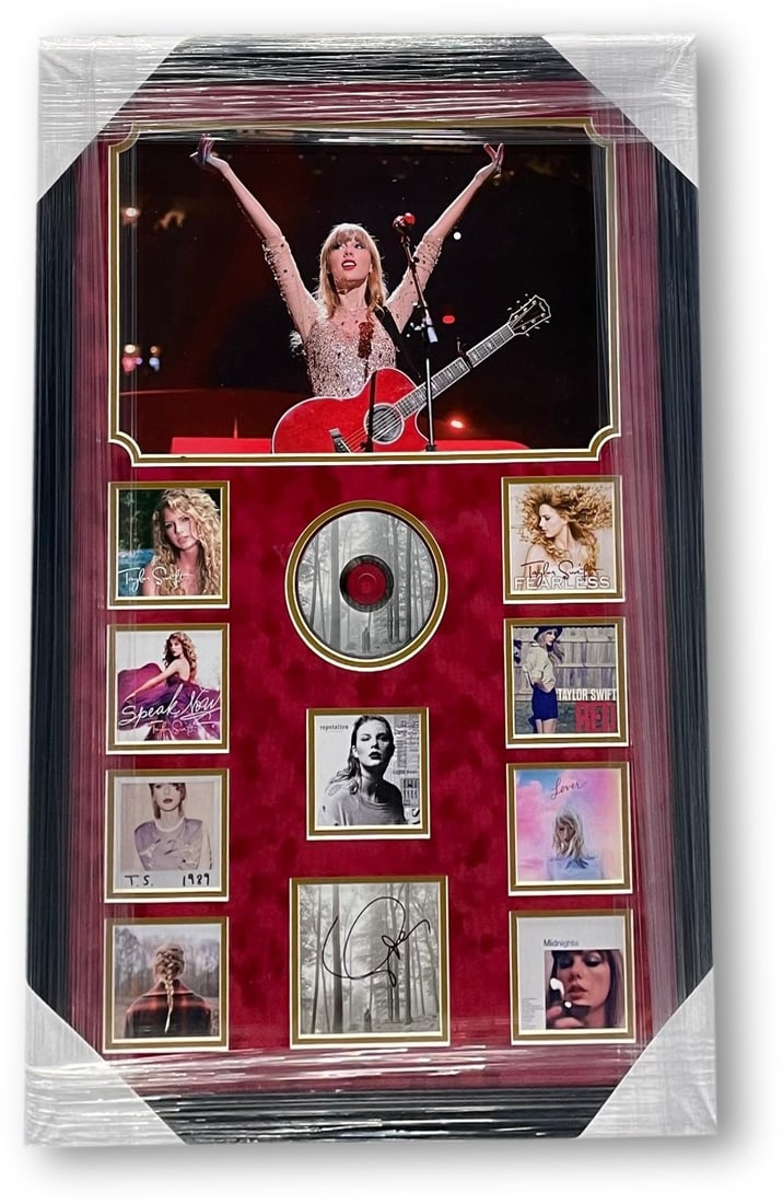 Taylor Swift Autographed CD Cover Custom Framed with GAI Authentication: Taylor Swift Autographed CD Cover Custom Framed with GAI Authentication This custom framed Taylor Swift autographed CD cover features an original signed album cover, CD, and additional covers, making