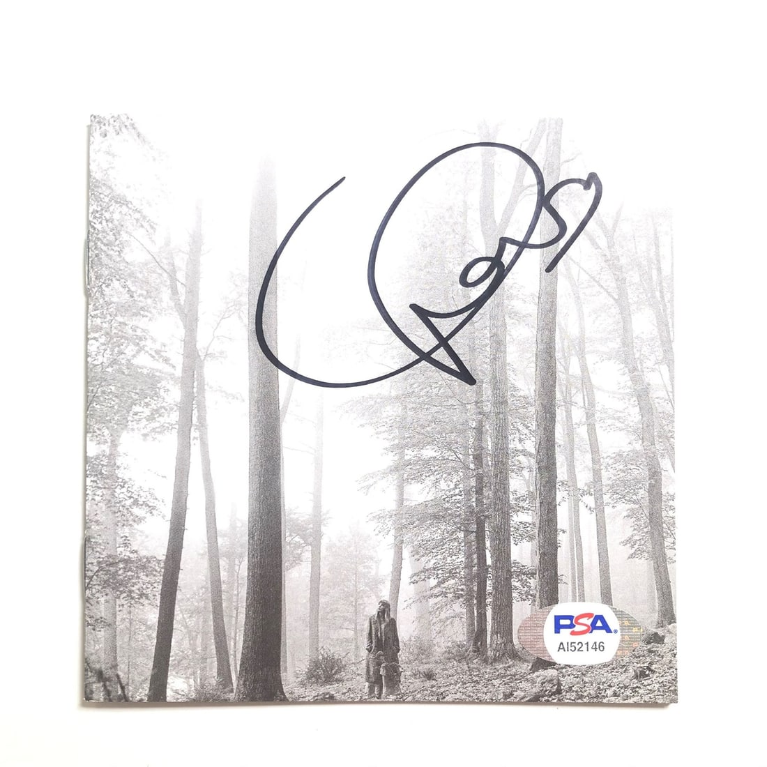 Taylor Swift Folklore Signed CD Cover with PSA/DNA Authentication: Taylor Swift Folklore Signed CD Cover with PSA/DNA Authentication This is an original CD album cover of Taylor Swift's 'Folklore', personally autographed by the artist herself. The signature has been