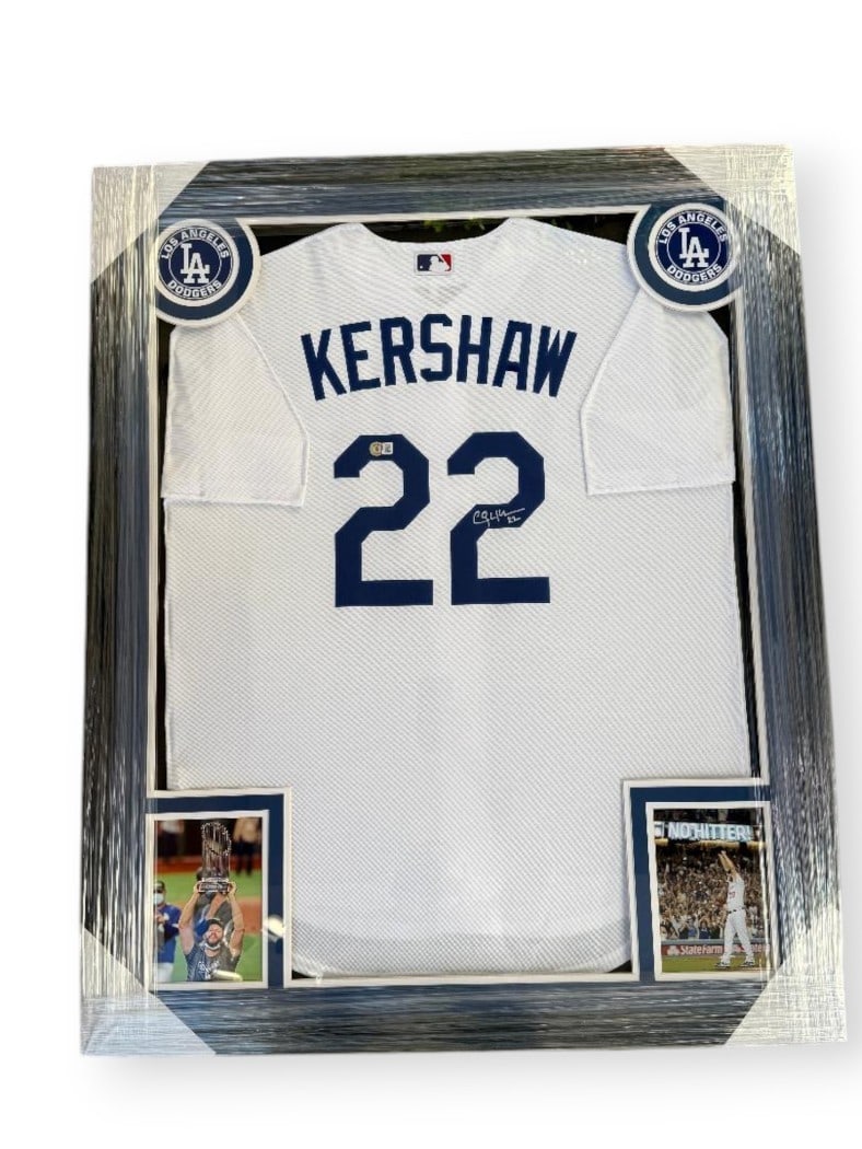 Framed Los Angeles Dodgers Jersey Signed by Clayton Kershaw Beckett Authenticated: Framed Los Angeles Dodgers Jersey Signed by Clayton Kershaw Beckett Authenticated This custom-framed white jersey features the hand-signed autograph of Clayton Kershaw, star pitcher for the Los Angele