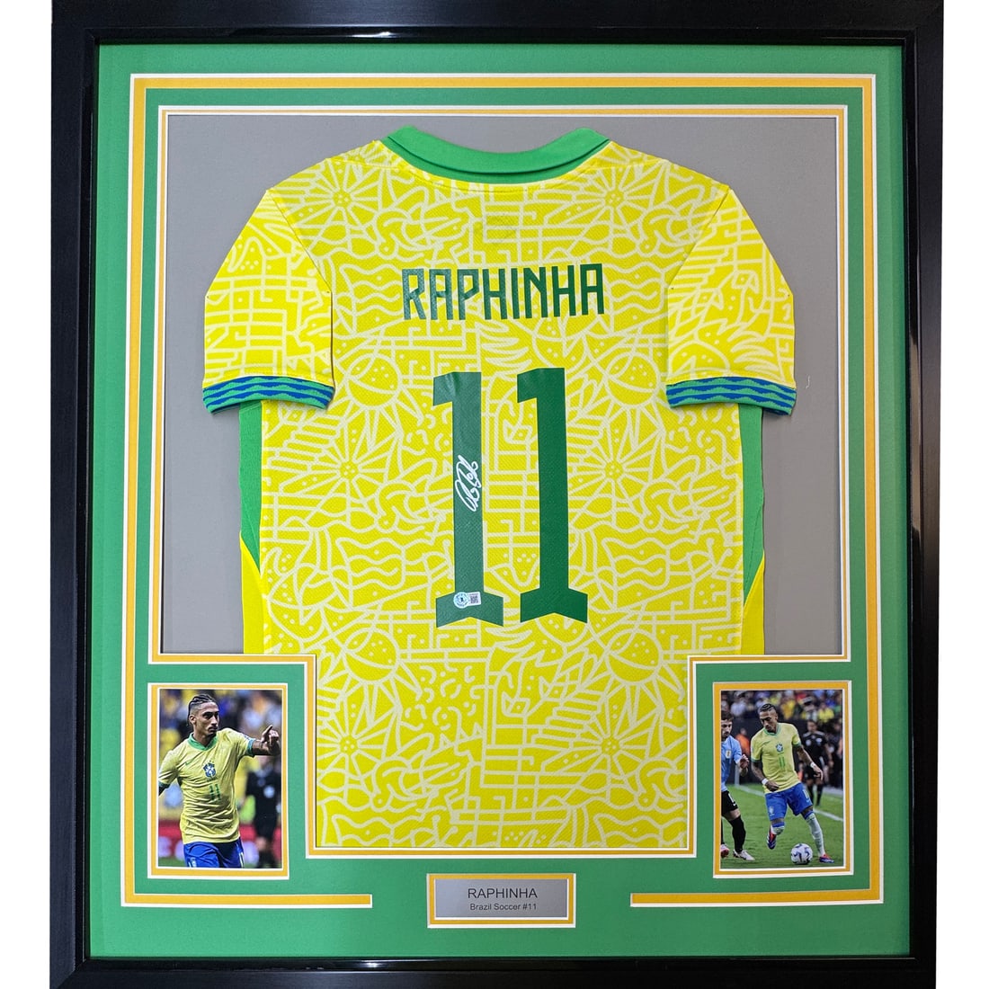Framed Autographed Raphinha Brazil Jersey 35x39 with BAS COA: Framed Autographed Raphinha Brazil Jersey 35x39 with BAS COA Celebrate the talent of Raphinha with this professionally framed and autographed Brazil yellow jersey. Measuring 35x39 inches, this strikin