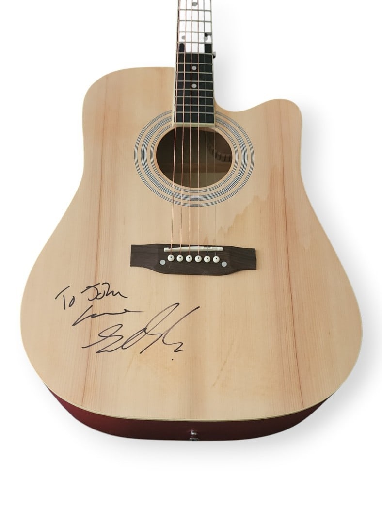 Acoustic Guitar Signed by Sheena Easton with JSA Authentication: Acoustic Guitar Signed by Sheena Easton with JSA Authentication This is an acoustic guitar and guitar pick autographed by Sheena Easton, featuring her signature and the song reference "Almost Over You