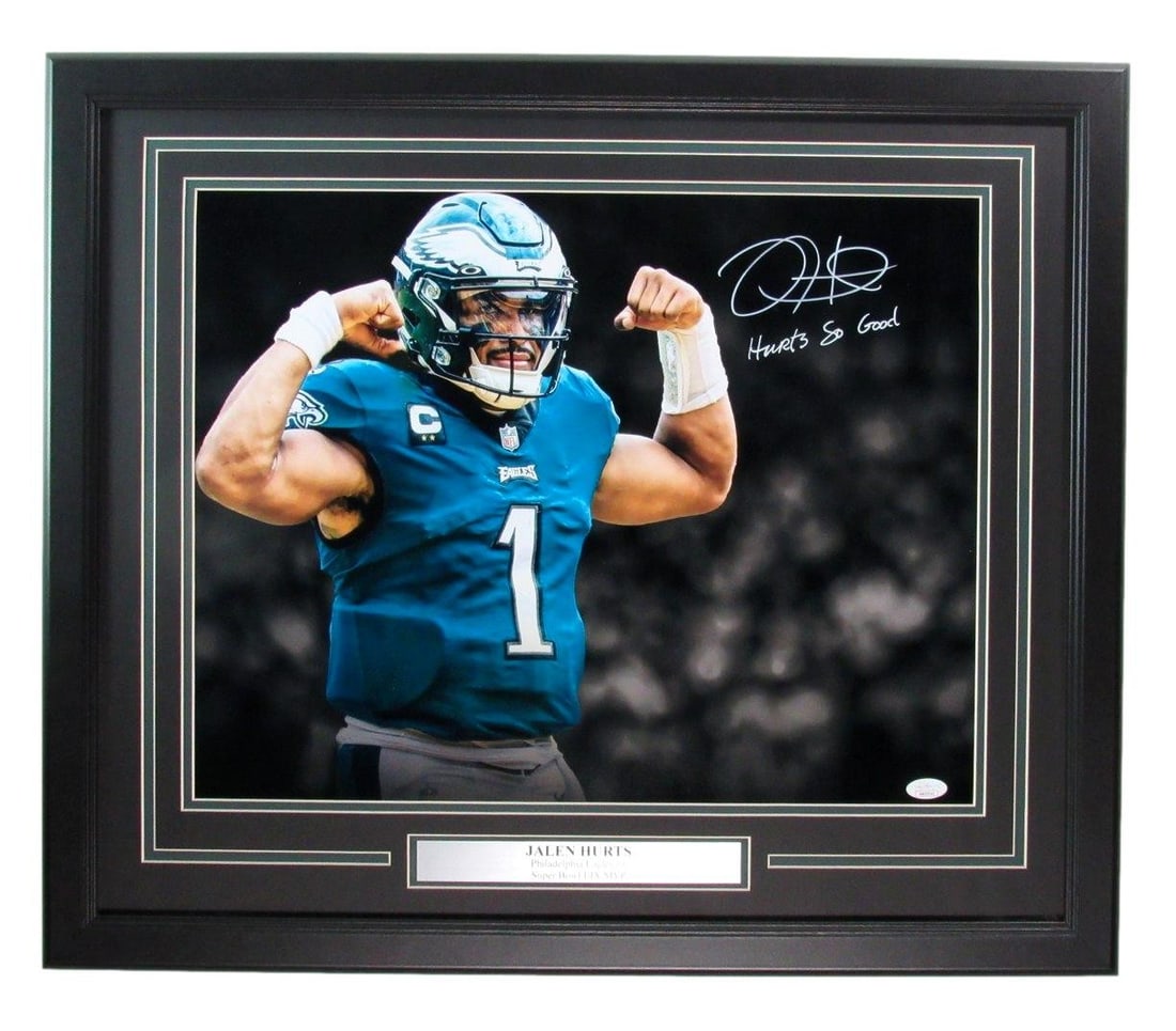 Framed 16x20 Jalen Hurts Autographed Photo With Inscription JSA Authenticated: Framed 16x20 Jalen Hurts Autographed Photo With Inscription JSA Authenticated This framed 16x20 photograph features Jalen Hurts of the Philadelphia Eagles, signed and inscribed with "Hurts so Good." T