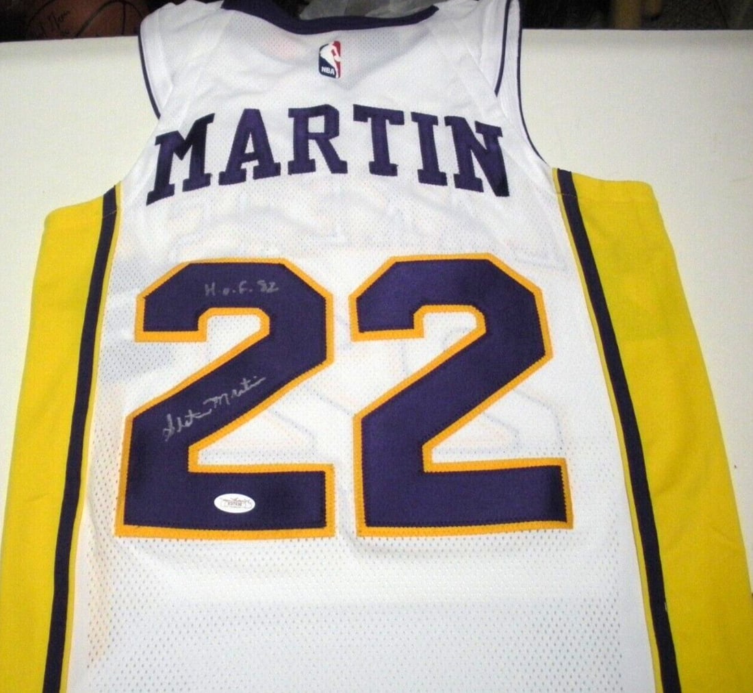 Slater Martin Los Angeles Lakers Signed Nike Jersey with JSA COA: Slater Martin Los Angeles Lakers Signed Nike Jersey with JSA COA This official licensed Nike jersey is signed by Slater Martin, a notable player in basketball history. It is a pre-owned item, showcasi