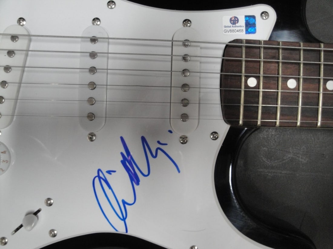Orianthi Panageris Autographed Electric Guitar Certified Authentic GAI: Orianthi Panageris Autographed Electric Guitar Certified Authentic GAI This is an authentic electric guitar autographed by Orianthi Panageris, a renowned guitarist known for her extraordinary talent.