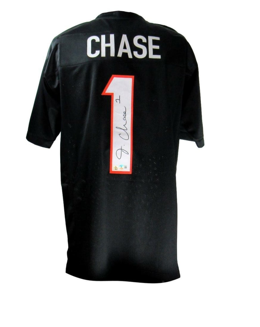 Ja'Marr Chase Autographed Cincinnati Bengals Custom Football Jersey Beckett Authenticated: Ja'Marr Chase Autographed Cincinnati Bengals Custom Football Jersey Beckett Authenticated This custom Cincinnati Bengals football jersey is signed by Ja'Marr Chase and features a black design in size
