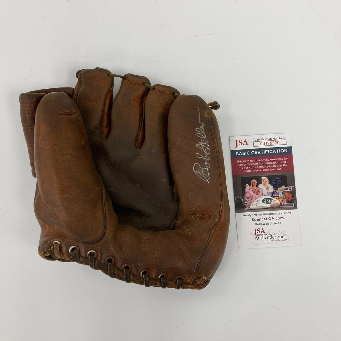 Bob Feller Signed 1950s Game Model Baseball Glove with JSA COA: Bob Feller Signed 1950s Game Model Baseball Glove with JSA COA This is a vintage baseball glove model from the 1950s, signed by the legendary pitcher Bob Feller. The glove comes with a James Spence Au