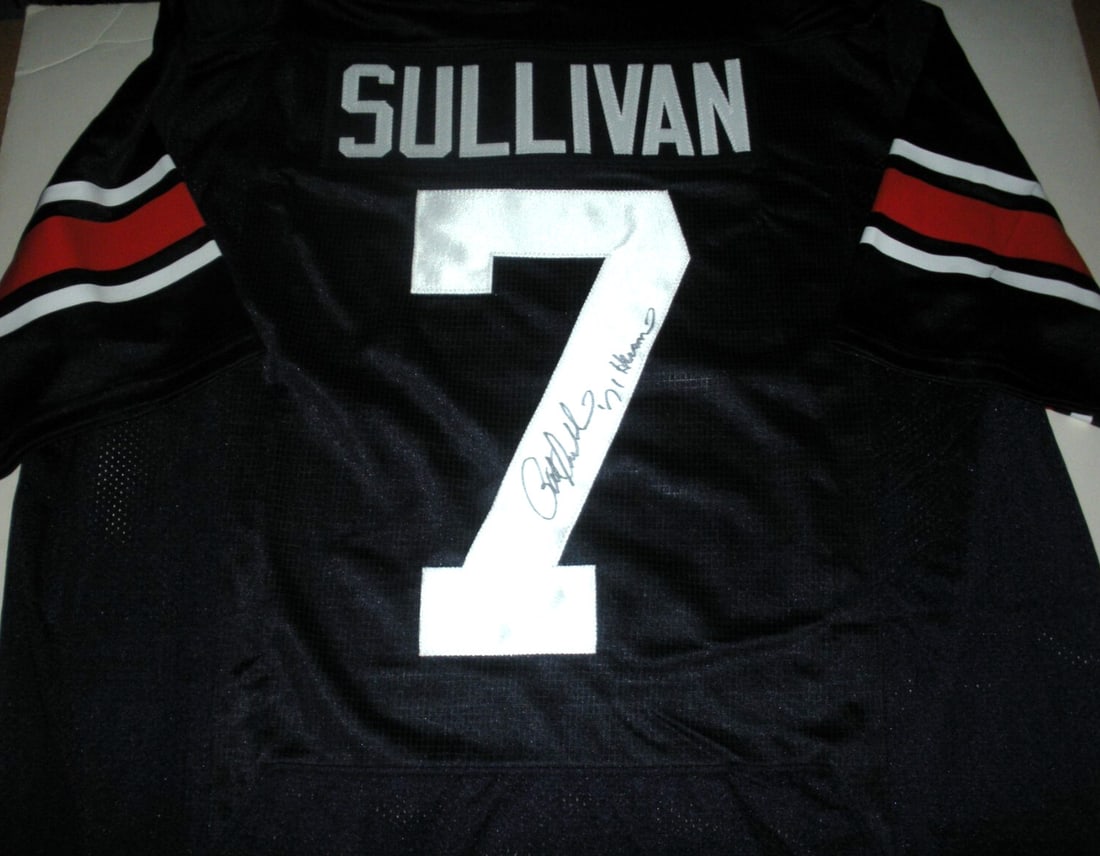 Pat Sullivan Signed Auburn Tigers Under Armour Jersey with COA: Pat Sullivan Signed Auburn Tigers Under Armour Jersey with COA This officially licensed Under Armour jersey features the signature of Pat Sullivan, a notable figure in Auburn Tigers football. The jers