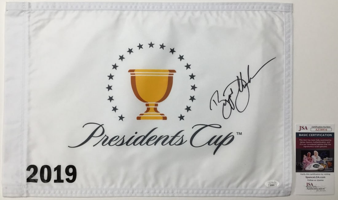 Bryson DeChambeau Signed 2019 President's Cup Pin Flag JSA Authenticated: Bryson DeChambeau Signed 2019 President's Cup Pin Flag JSA Authenticated This official The President's Cup 2019 pin flag is signed by PGA star Bryson DeChambeau and comes authenticated by James Spence