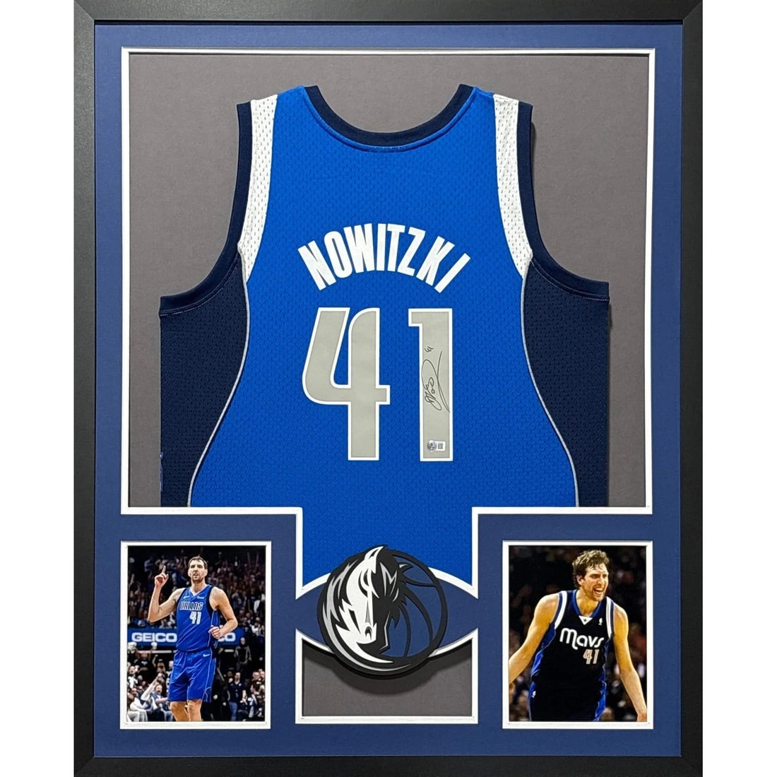 Framed Dirk Nowitzki Signed Mavericks Jersey Beckett Authenticated with 42x34 Frame: Framed Dirk Nowitzki Signed Mavericks Jersey Beckett Authenticated with 42x34 Frame This is a framed Dallas Mavericks jersey autographed by Dirk Nowitzki. The jersey is authenticated by Beckett and in