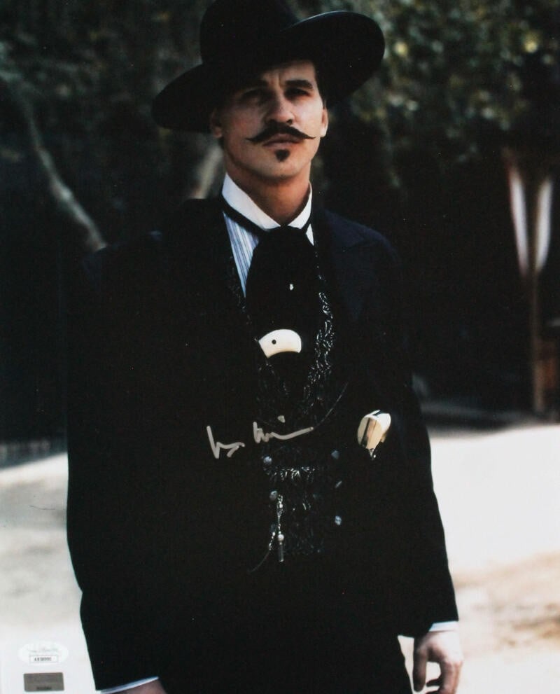 Val Kilmer Signed Tombstone 11x14 Photo JSA Authenticated: Val Kilmer Signed Tombstone 11x14 Photo JSA Authenticated Capture a piece of cinematic history with this original 11x14 photograph from the iconic film "Tombstone," featuring the signature of Val Kilm
