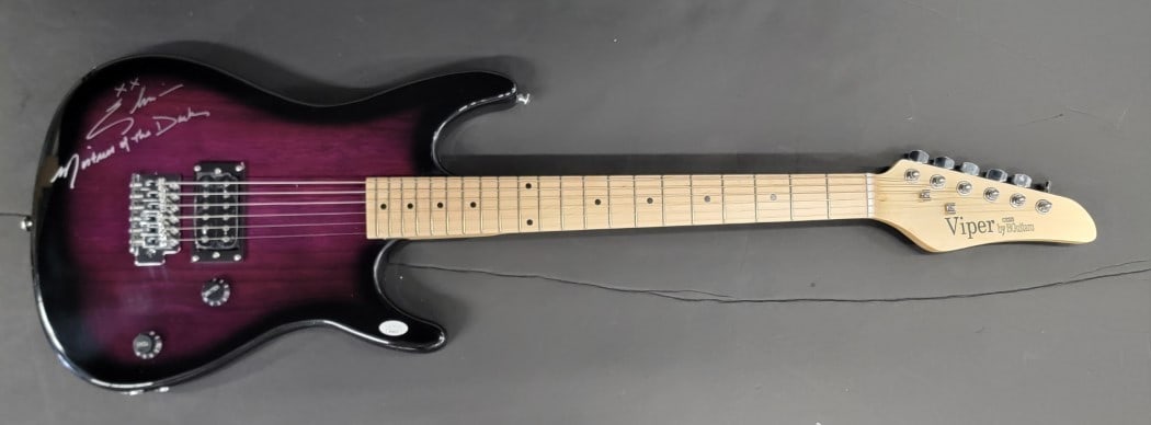 Cassandra Peterson Elvira Autographed Electric Guitar JSA Certified: Cassandra Peterson Elvira Autographed Electric Guitar JSA Certified This is an authentic electric guitar autographed by Cassandra Peterson, famously known as Elvira. The signature is verified by James