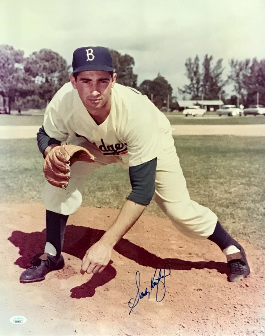 Sandy Koufax Signed 16x20 Vintage Photo JSA Authenticated: Sandy Koufax Signed 16x20 Vintage Photo JSA Authenticated This vintage 16x20 photo captures baseball legend Sandy Koufax of the Los Angeles Dodgers in a stunning display. Signed perfectly in bright bl