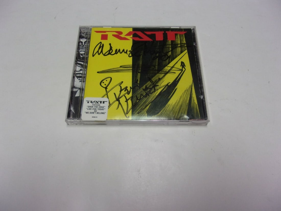 Signed RATT CD with COA Autographed by Pearcy DeMartini and Kelli: Signed RATT CD with COA Autographed by Pearcy DeMartini and Kelli This is an original CD signed by Stephen Pearcy, Warren DeMartini, and Kerri Kelly from the heavy metal band RATT. The item includes a