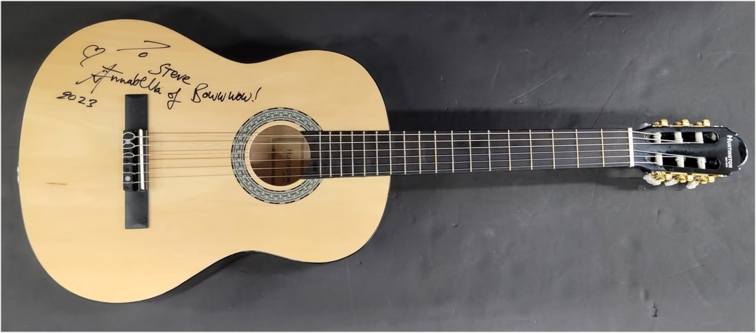 Annabella Lwin Autographed Acoustic Guitar with Beckett Authentication: Annabella Lwin Autographed Acoustic Guitar with Beckett Authentication This is an original acoustic guitar signed by Annabella Lwin, featuring a personal inscription "To Steve... Boww wow! 2023". The