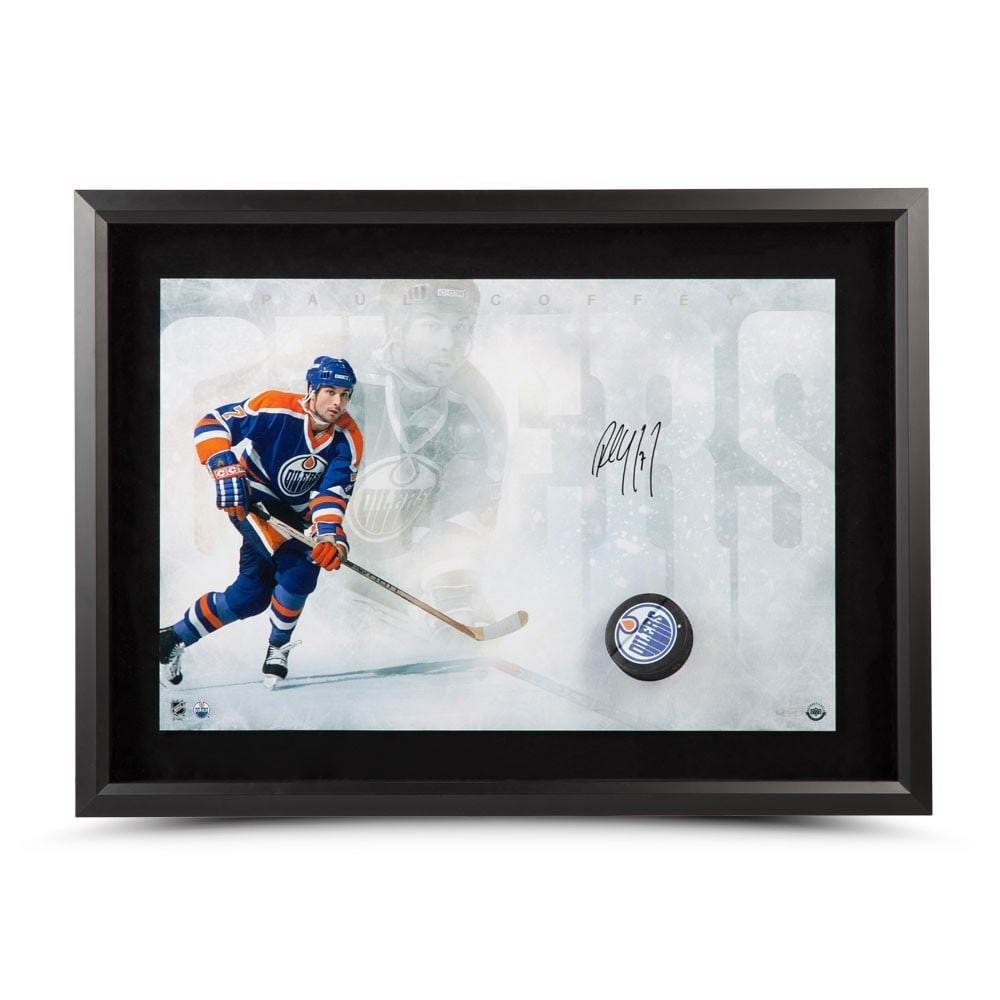 Paul Coffey Autographed 16X24 Break Thru Photo Edmonton Oilers: Paul Coffey Autographed 16X24 Break Thru Photo Edmonton Oilers This is an original autographed 16x24 photo featuring Paul Coffey, a legendary player from the Edmonton Oilers. The photo captures a dyna