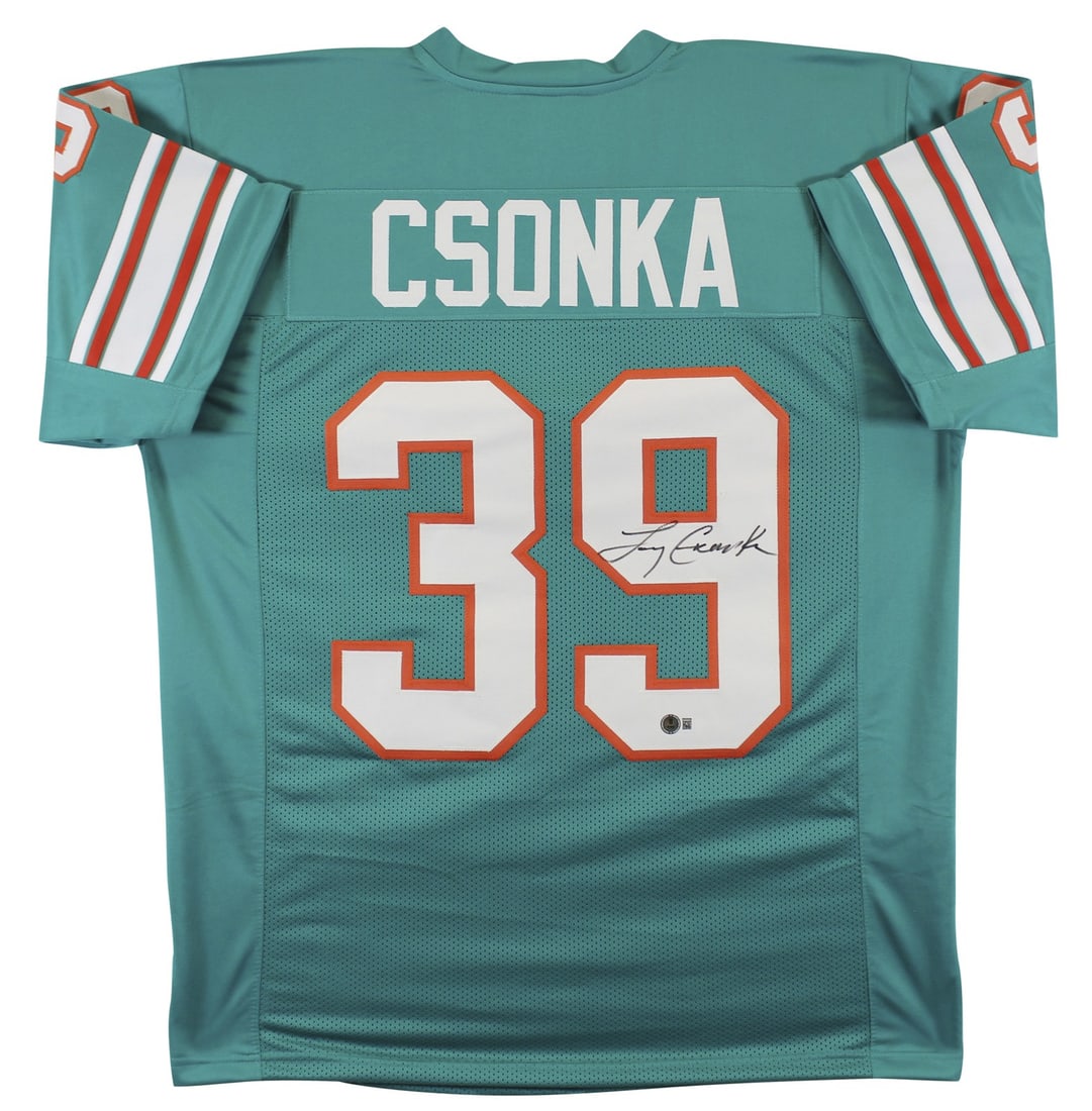Larry Csonka Signed Miami Dolphins Teal Jersey BAS Witnessed Authentic: Larry Csonka Signed Miami Dolphins Teal Jersey BAS Witnessed Authentic This Authentic Signed Teal Pro Style Jersey has been personally signed by Larry Csonka, the legendary player from the Miami Dolph