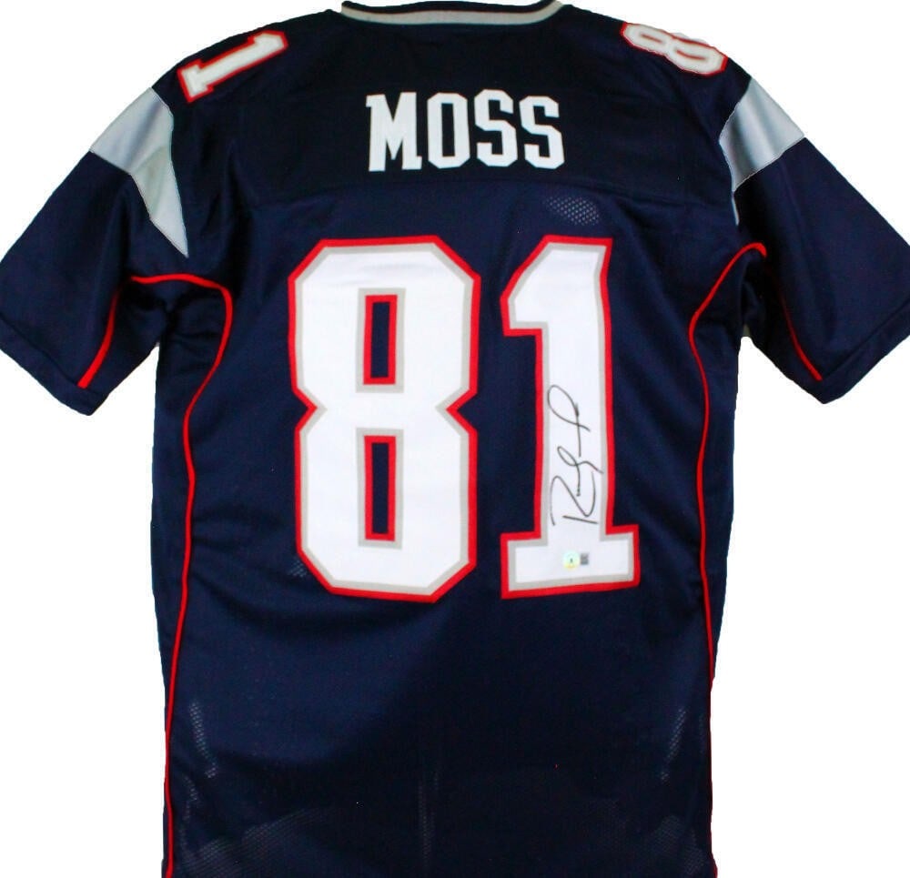 Beckett Authenticated Randy Moss Signed Blue Patriots Jersey: Beckett Authenticated Randy Moss Signed Blue Patriots Jersey This is a blue pro style jersey autographed by Randy Moss, featuring authentication from Beckett with a W hologram. The jersey represents