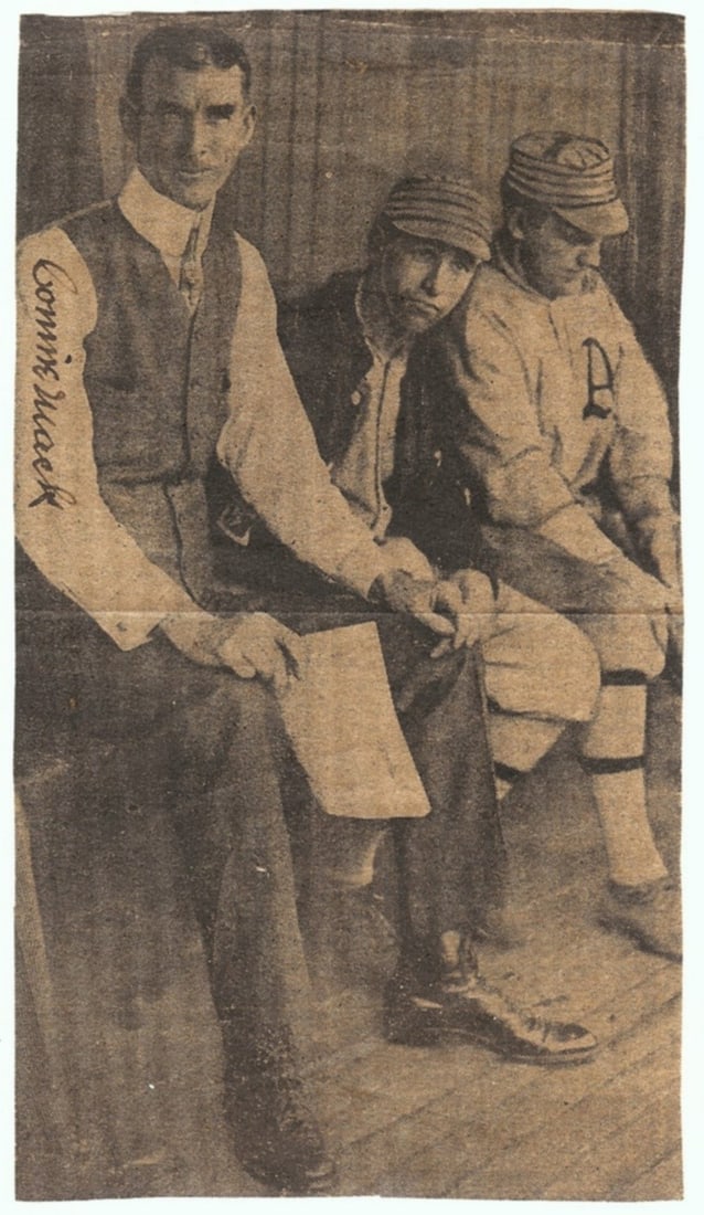 Connie Mack Autographed Newspaper Photo JSA Authentic: Connie Mack Autographed Newspaper Photo JSA Authentic This original newspaper photo features Connie Mack, the legendary manager of the Philadelphia Athletics, seated in the dugout. The photo is autogr