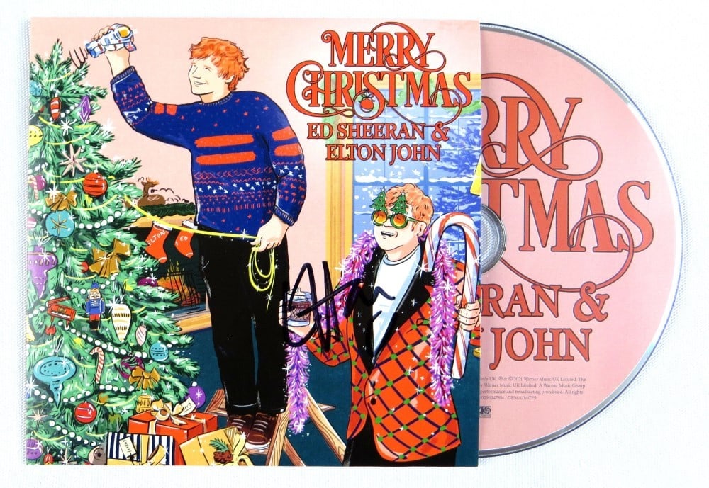 Elton John Ed Sheeran Signed CD Cover with JSA Authentication: Elton John Ed Sheeran Signed CD Cover with JSA Authentication Celebrate the holiday season with this Elton John signed CD cover featuring his Merry Christmas album, complete with a collaboration with