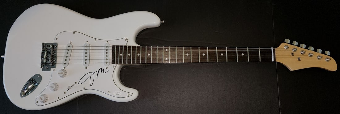 Janelle Monae Hand Signed Electric Guitar Authenticated JSA: Janelle Monae Hand Signed Electric Guitar Authenticated JSA This is an authentic electric guitar autographed by the talented Janelle Monae, verified by James Spence Authentication (JSA). The guitar sh