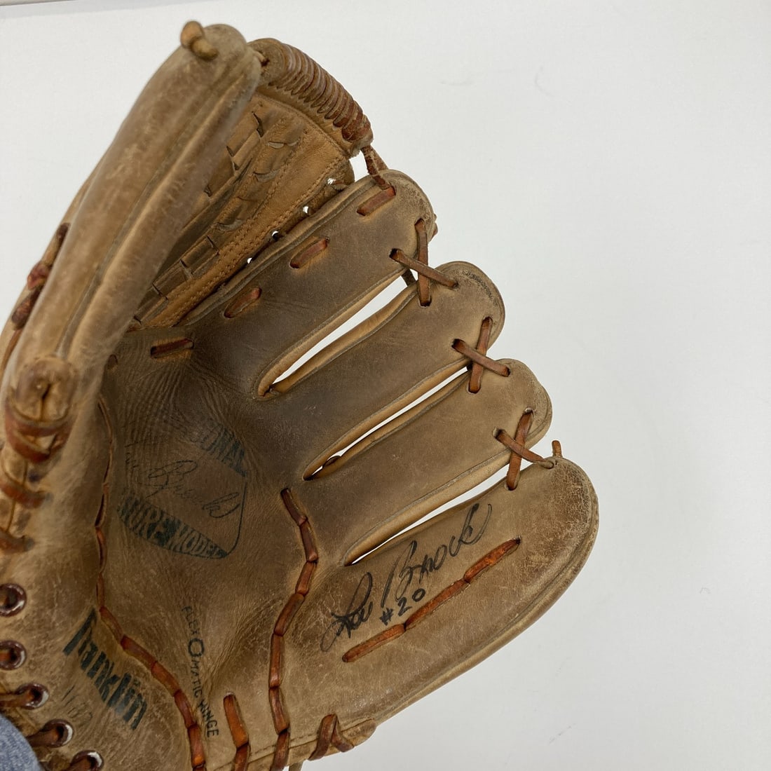 Lou Brock Signed Vintage Franklin Baseball Glove with JSA COA: Lou Brock Signed Vintage Franklin Baseball Glove with JSA COA This vintage Franklin Game Model baseball glove is signed by the legendary Lou Brock, a prominent figure in baseball history. The glove is