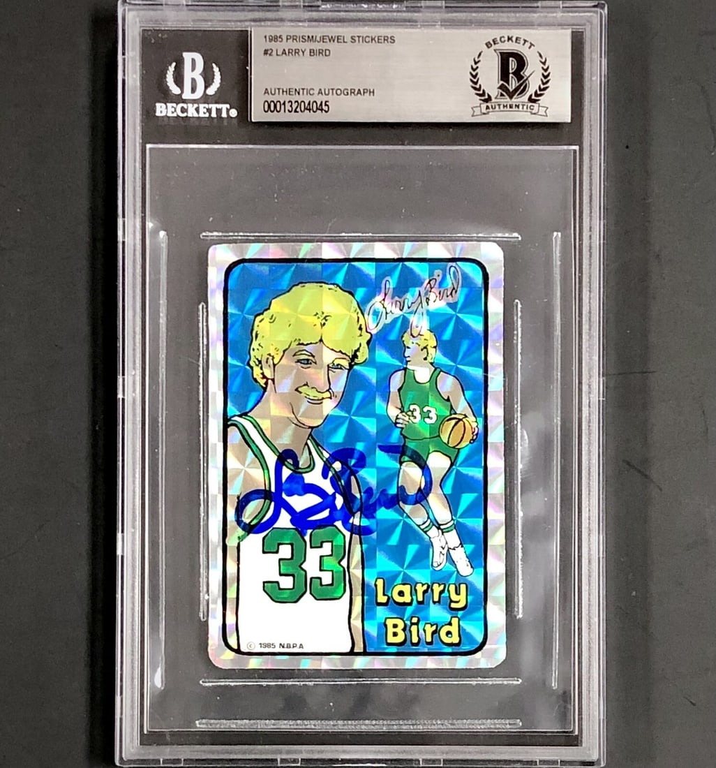 Larry Bird Signed 1985 Prism Jewel Sticker Card Beckett Authenticated: Larry Bird Signed 1985 Prism Jewel Sticker Card Beckett Authenticated This is a rare 1985 Prism Jewel Sticker card featuring the iconic Larry Bird, a legendary player of the Boston Celtics. The card i