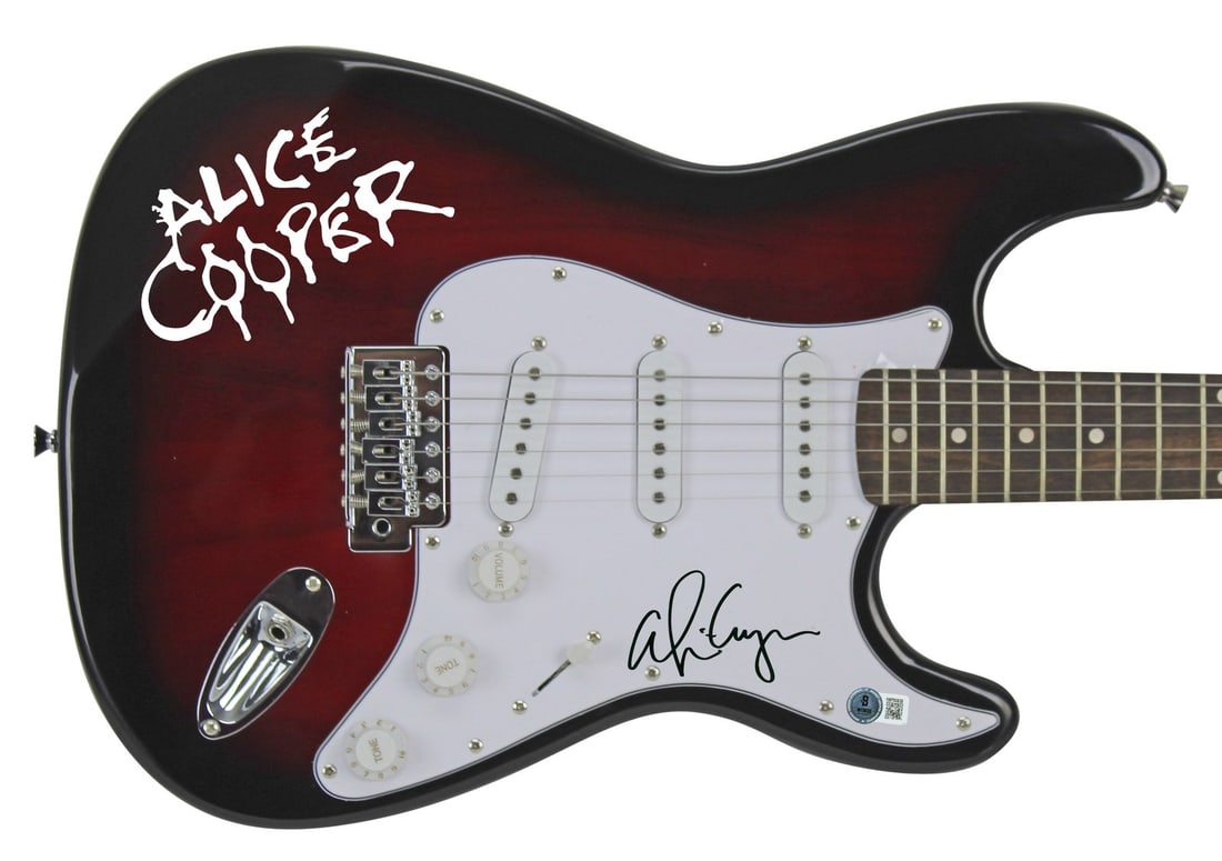 Red Sunburst Electric Guitar Signed by Alice Cooper Beckett Witness COA: Red Sunburst Electric Guitar Signed by Alice Cooper Beckett Witness COA This red sunburst electric guitar, accompanied by a guitar pick and decal, has been personally signed by Alice Cooper. The