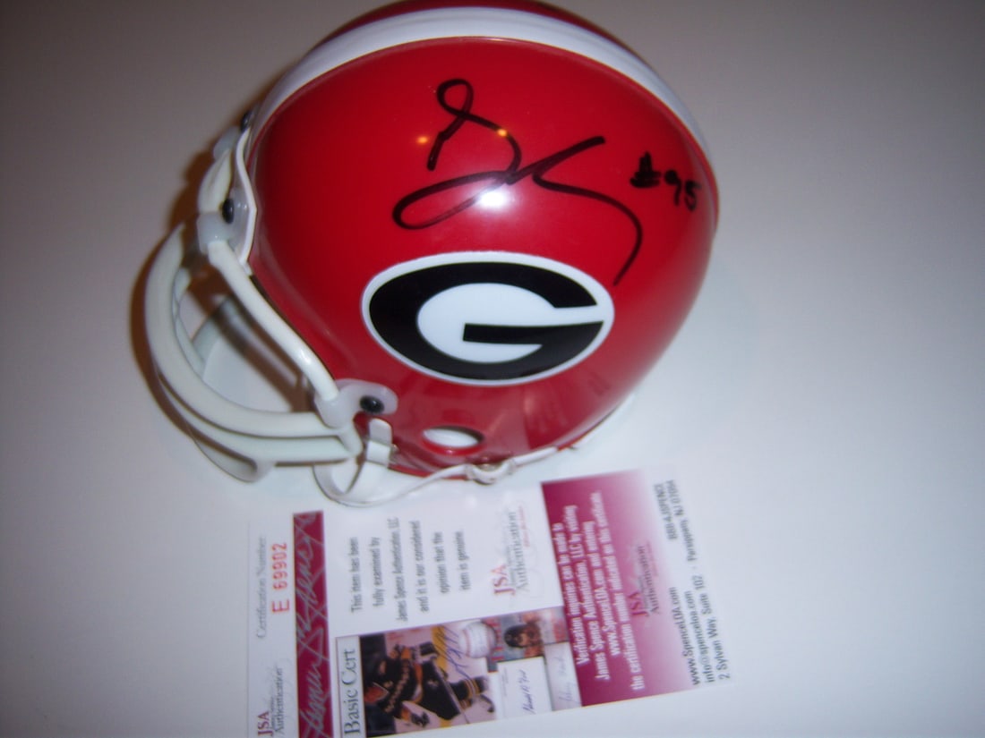 Georgia Mini Football Helmet Signed by Goldberg Dooley Trippi with JSA COA: Georgia Mini Football Helmet Signed by Goldberg Dooley Trippi with JSA COA This mini helmet features signatures from Bill Goldberg, Vince Dooley, and Charley Trippi, all associated with Georgia footba