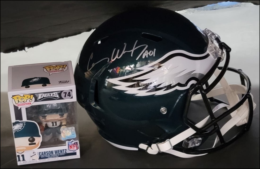 Carson Wentz Autographed Philadelphia Eagles Helmet with Funko Pop Figure: Carson Wentz Autographed Philadelphia Eagles Helmet with Funko Pop Figure This authentic Carson Wentz signed helmet is a must-have for any Philadelphia Eagles fan. The helmet features the autograph of